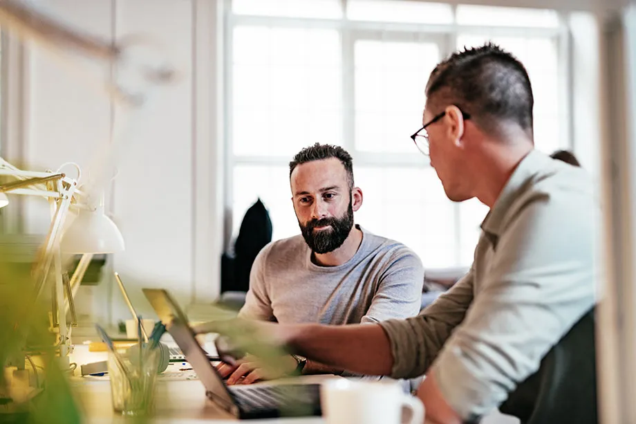 A startup team working around one table